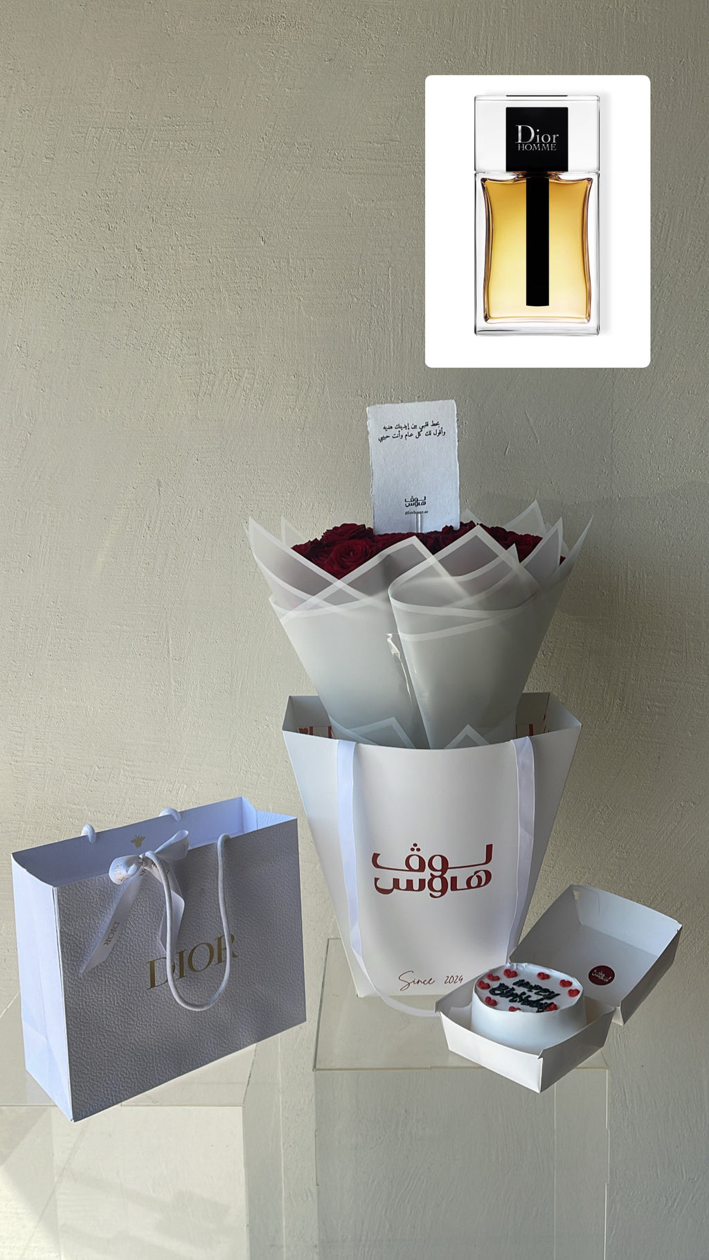 عطر Dior مع باقة حمراء وكيكة