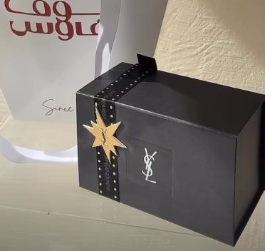 ميدالية الغزال وعطر ysl