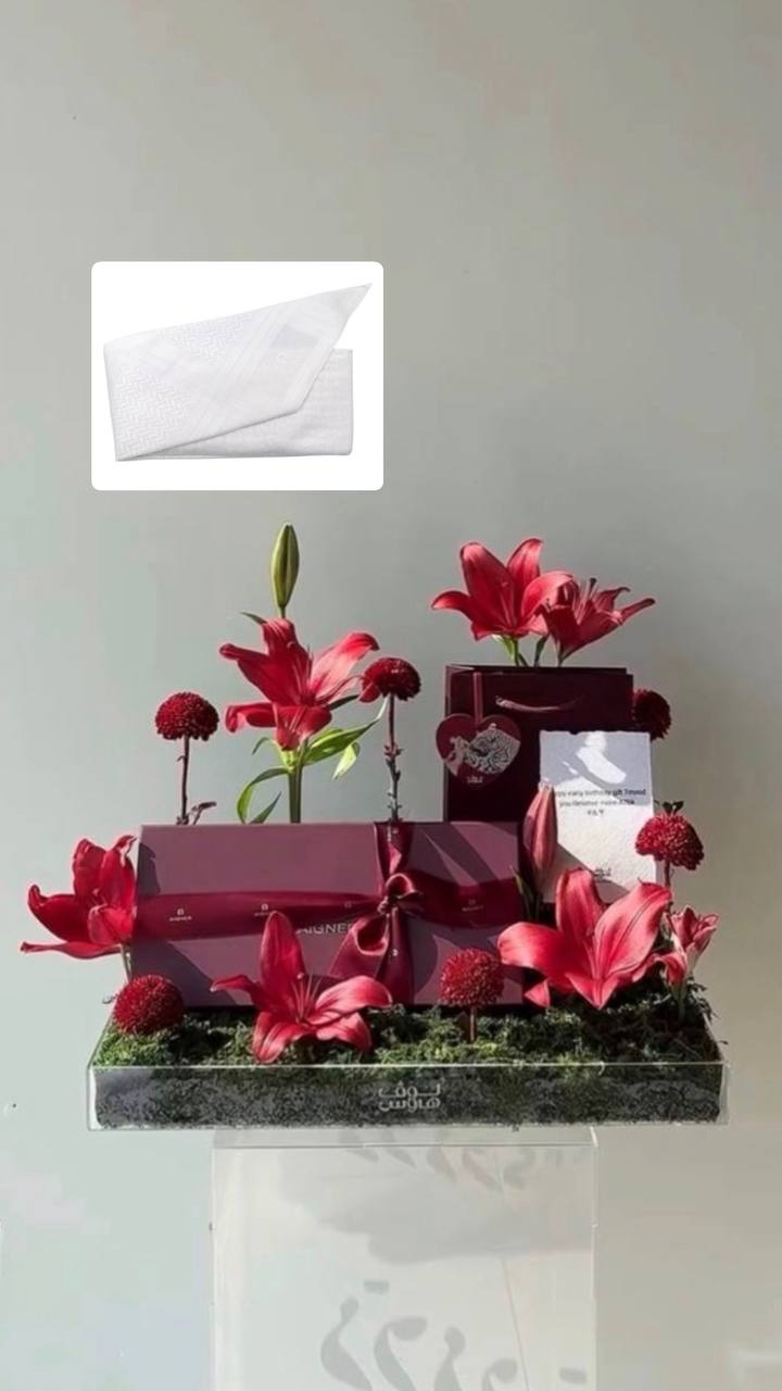 وميدالية الغزال  Aigner شماغ ابيض من